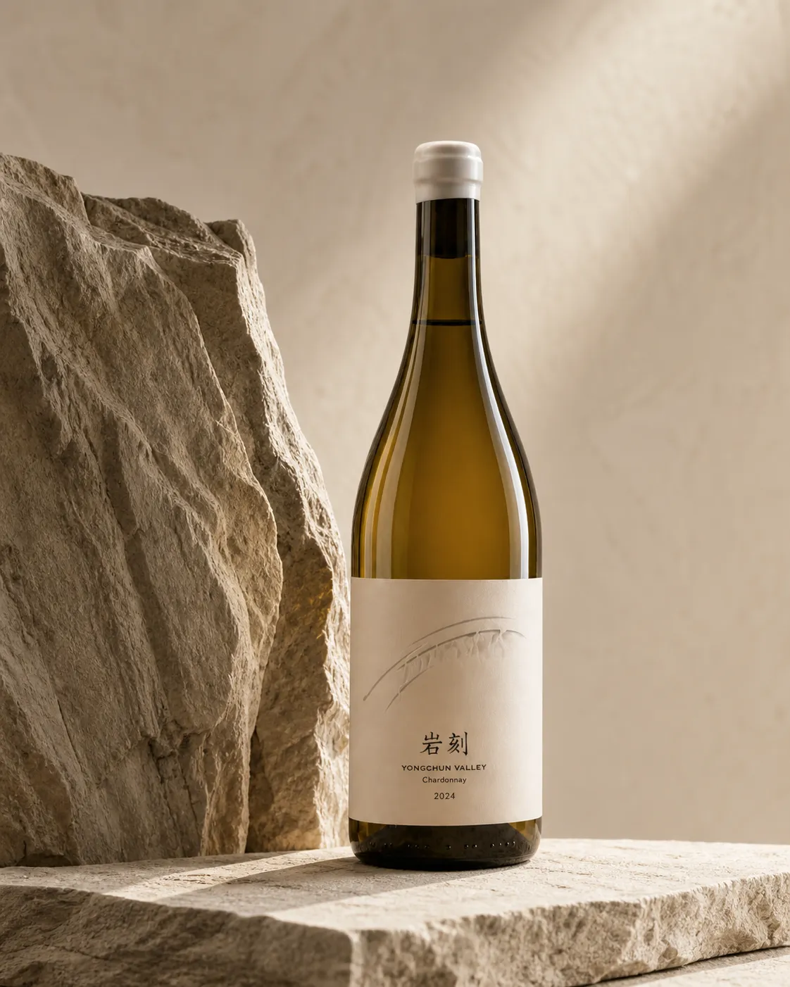 Yanker bottle placed beside a tall chalky stone in soft directional light
