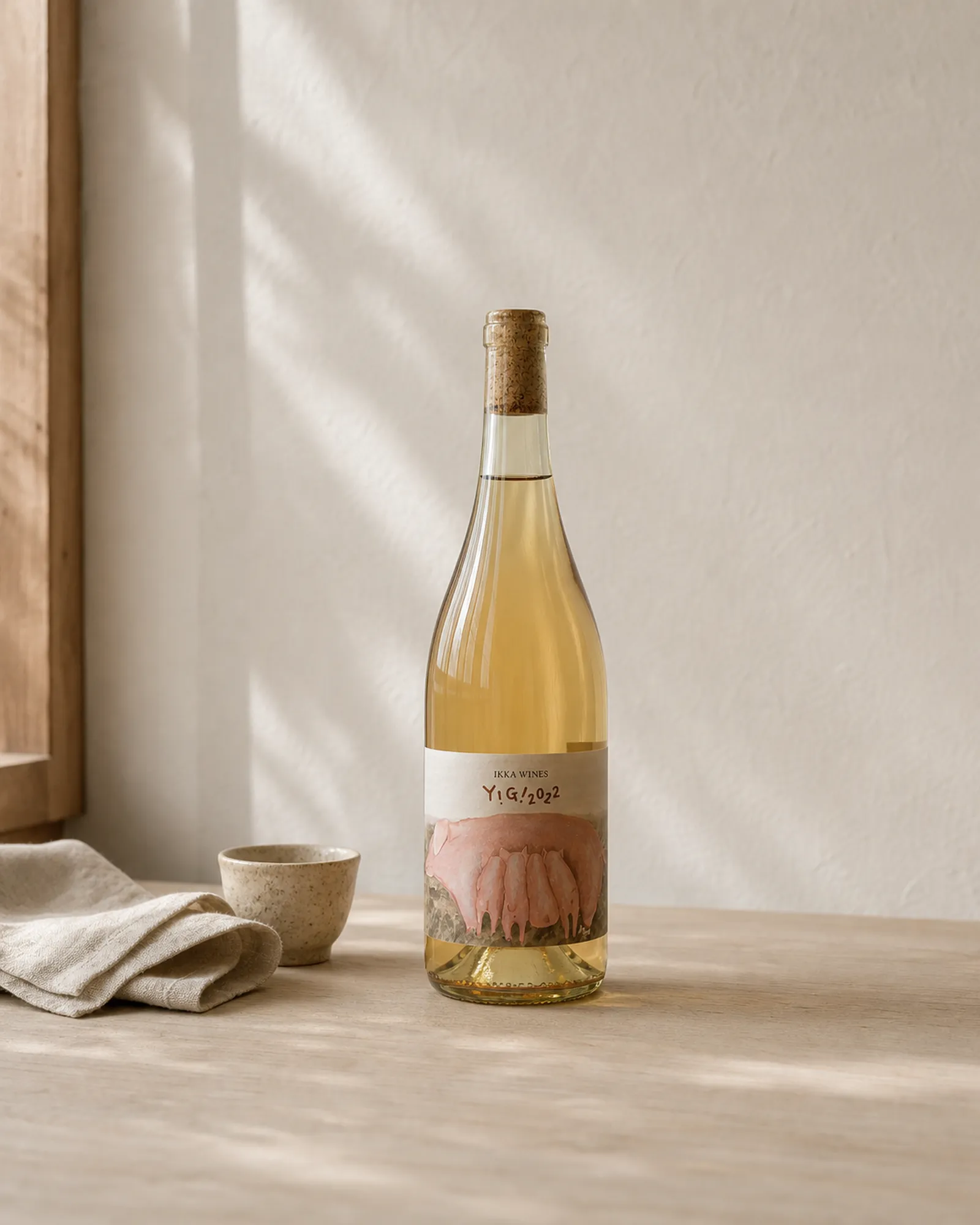 IKKA WINES Y!G! bottle in soft light with a pig group label