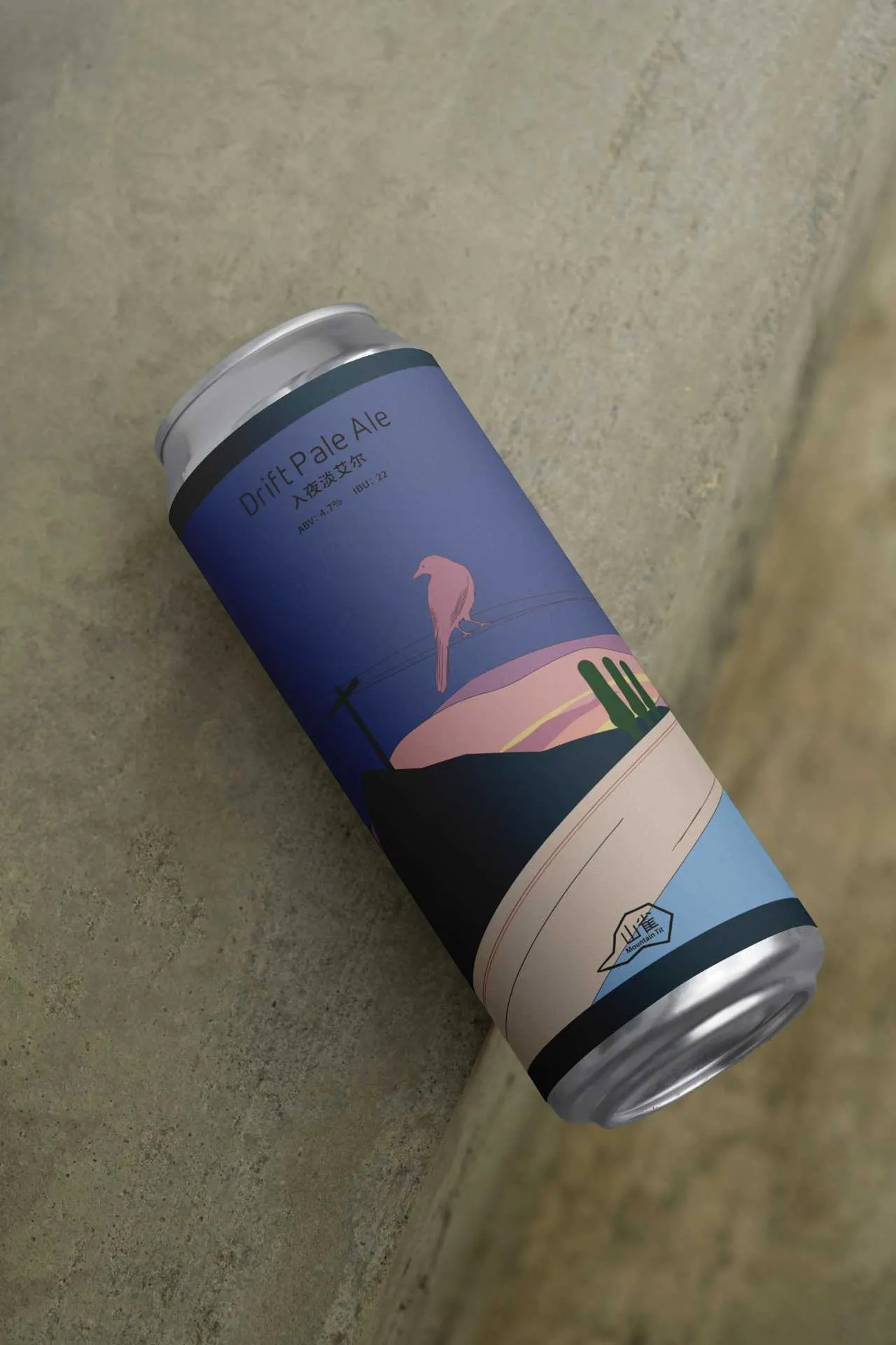 Angled close-up of the Drift Pale Ale can showing the bird, wires and evening road graphic