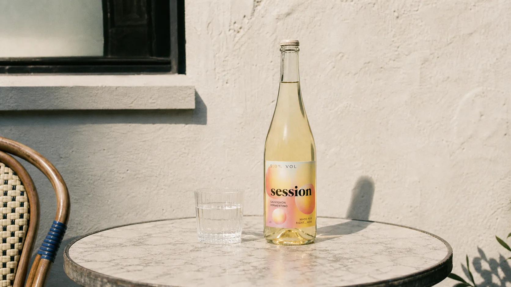 SESSION WINE bottle on a sunlit cafe table