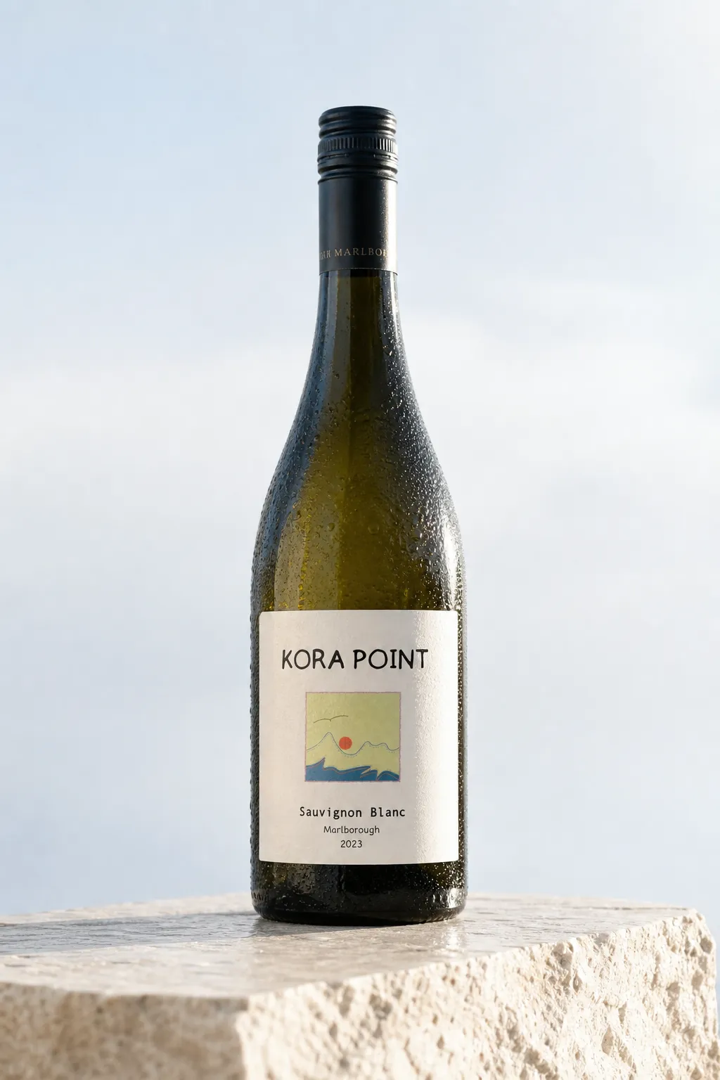 KORA POINT bottle isolated on a pale stone plinth in clean cool daylight